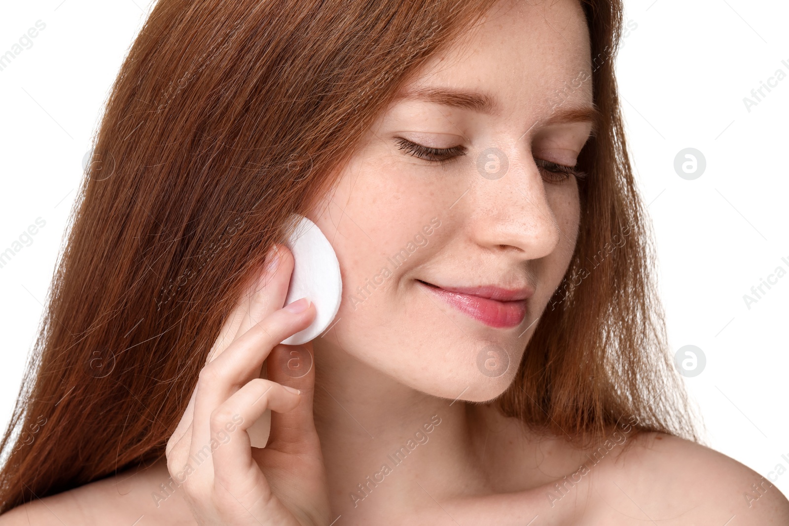 Photo of Beautiful woman with freckles wiping face on white background