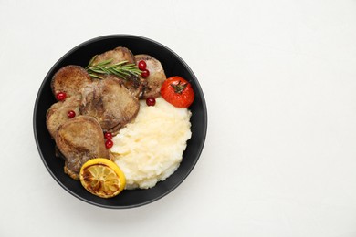 Photo of Tasty beef tongue pieces, berries, lemon, rosemary, tomato and mashed potatoes on white table, top view. Space for text
