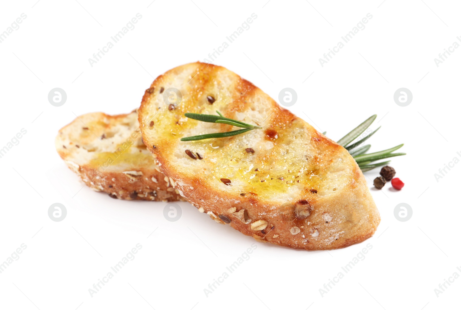 Photo of Tasty bruschettas with oil, rosemary and pepper on white background