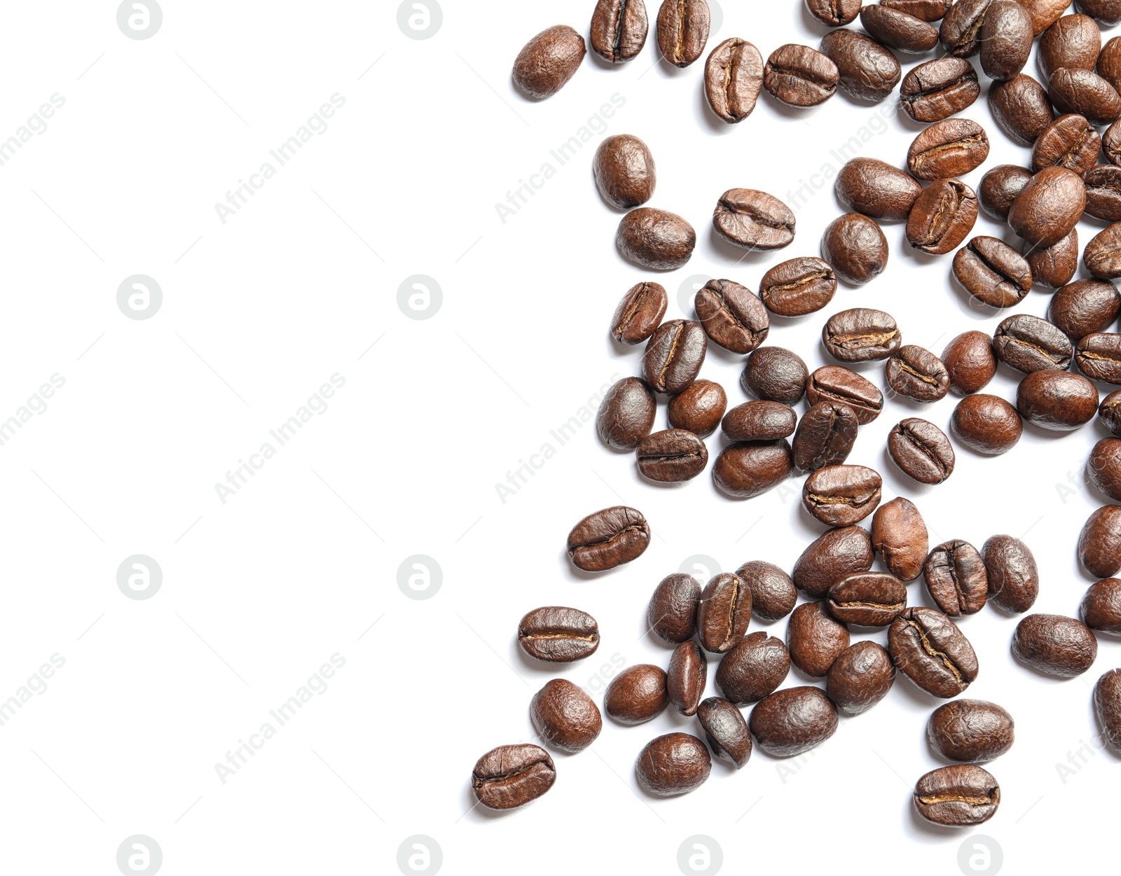 Photo of Roasted coffee beans on white background, top view