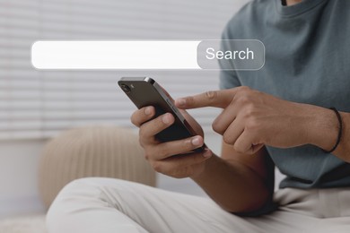 Search bar of website over smartphone. Man using device indoors, closeup