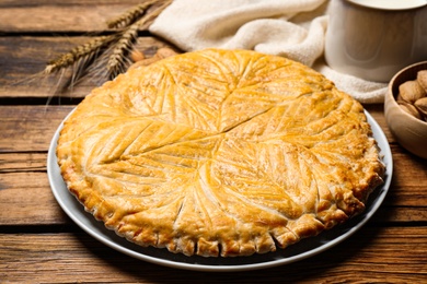 Traditional galette des rois on wooden table