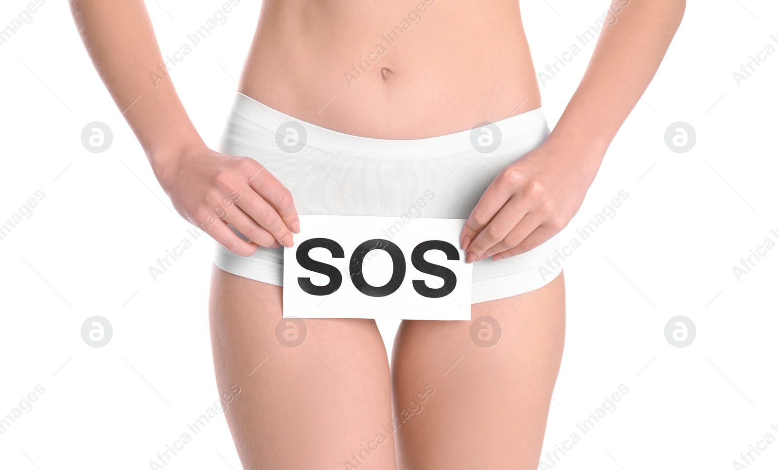 Photo of Young woman holding paper with word SOS near underwear on white background. Gynecology