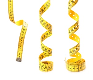 Image of Set of yellow measuring tapes on white background