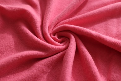 Photo of Beautiful pink fabric as background, closeup view