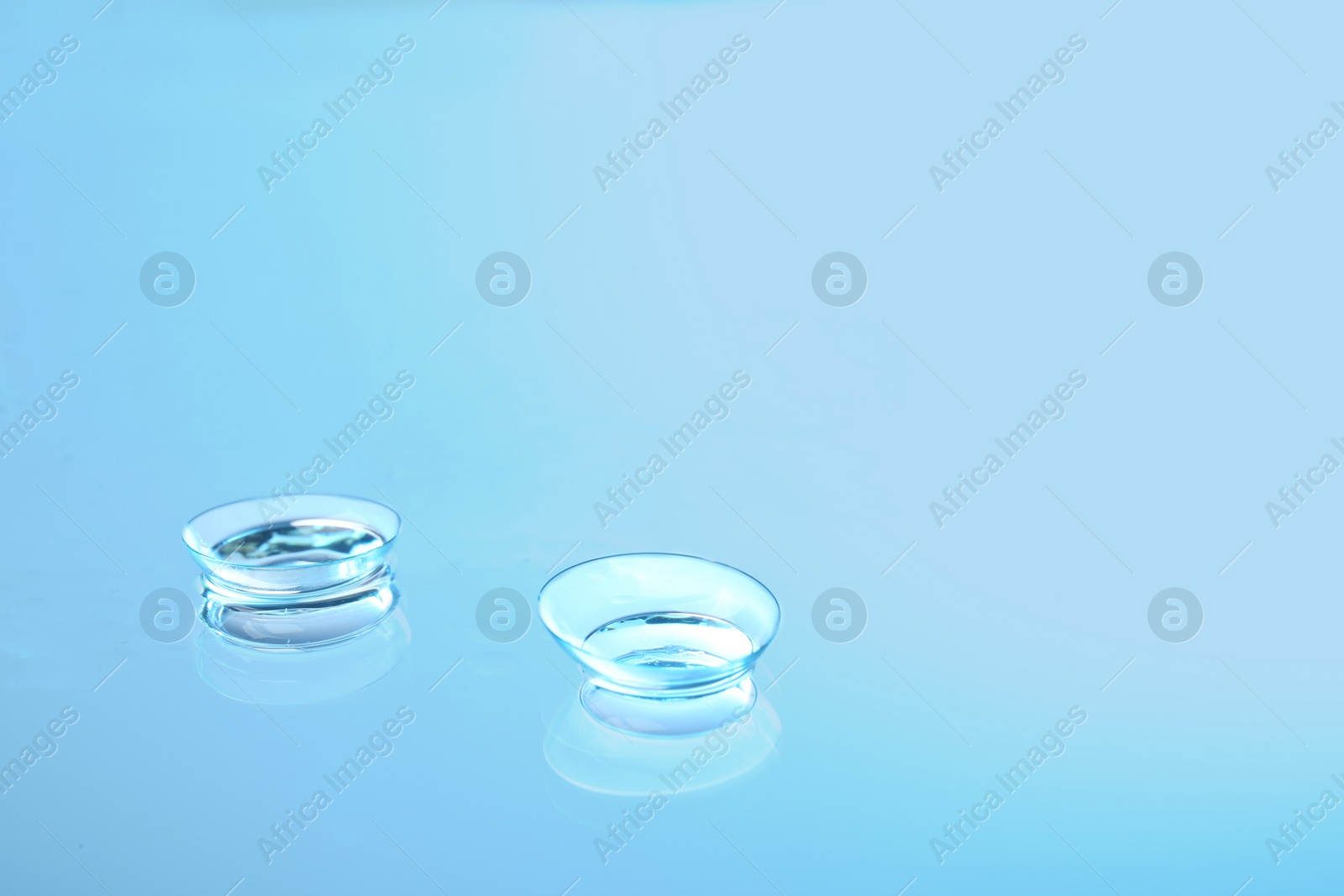 Photo of Contact lenses on glass background