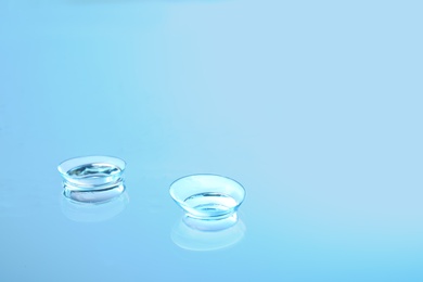 Photo of Contact lenses on glass background