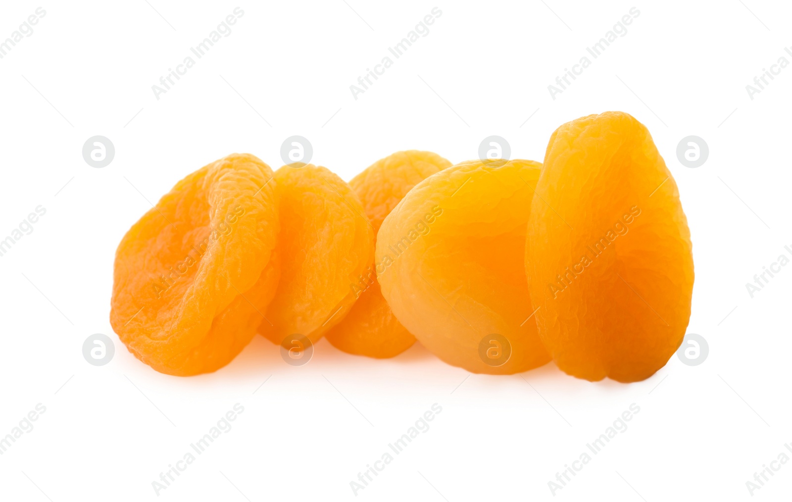 Photo of Pile of tasty apricots on white background. Dried fruits