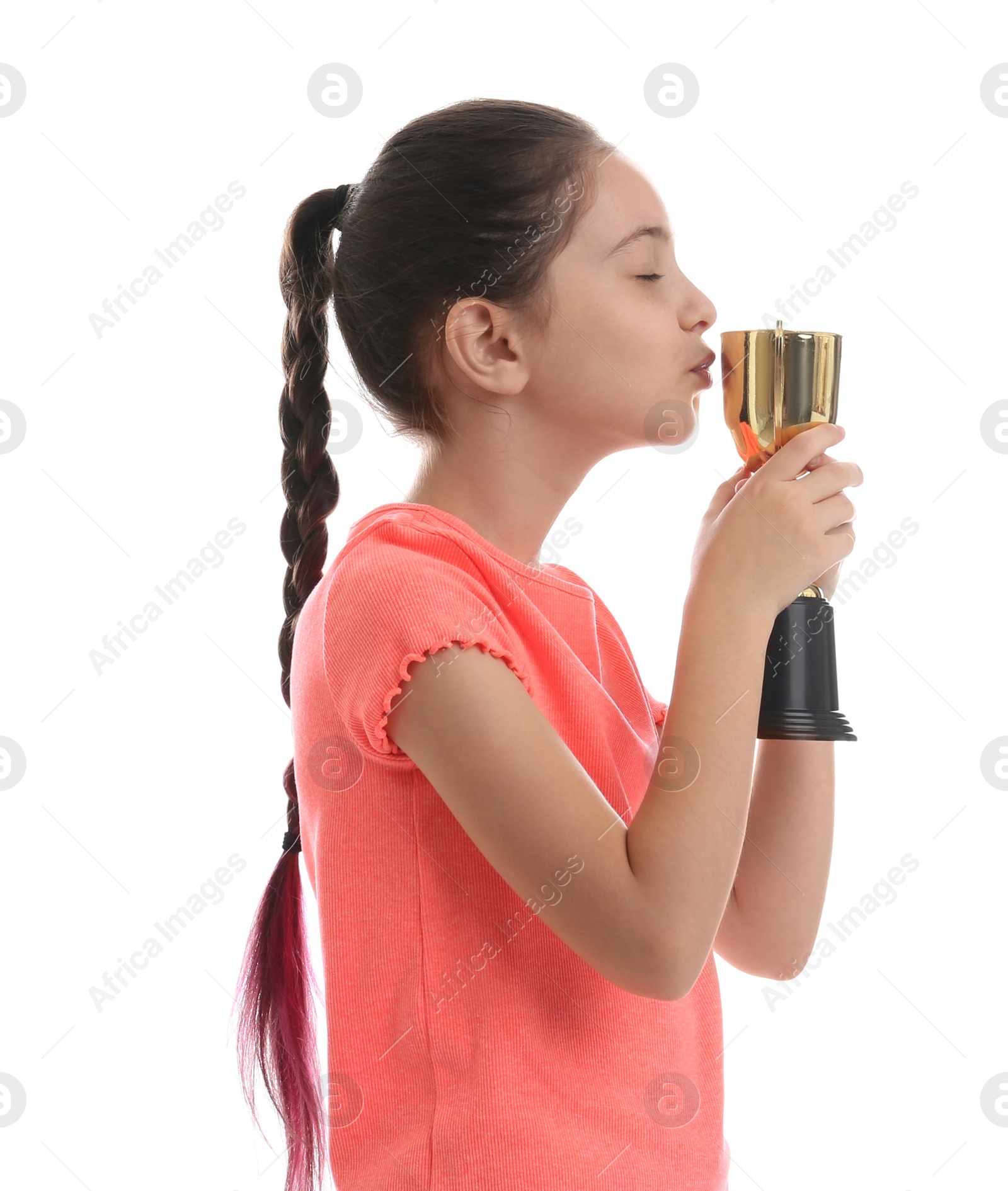 Photo of Happy girl kissing golden winning cup isolated on white