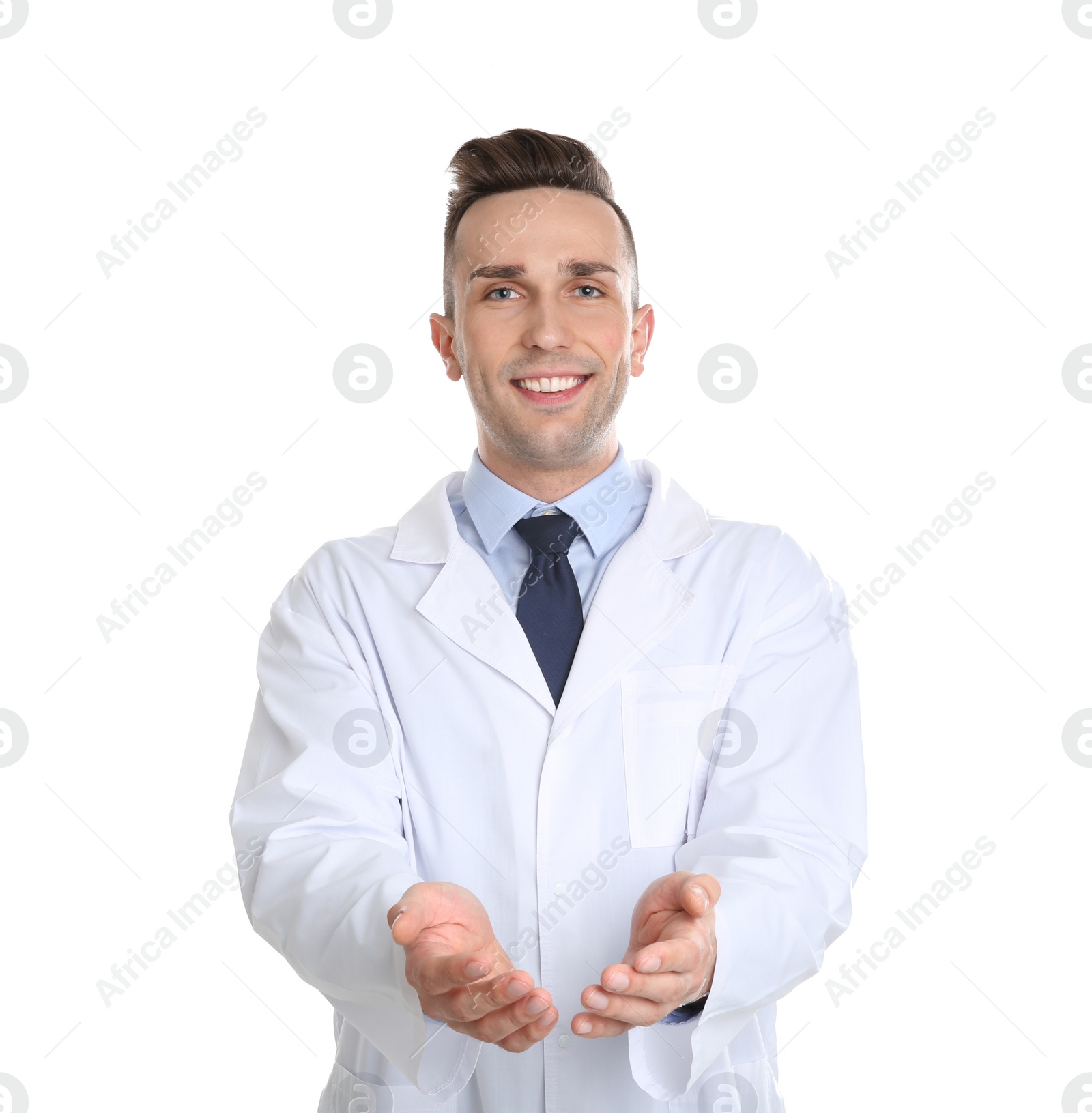 Photo of Male dentist holding something on white background