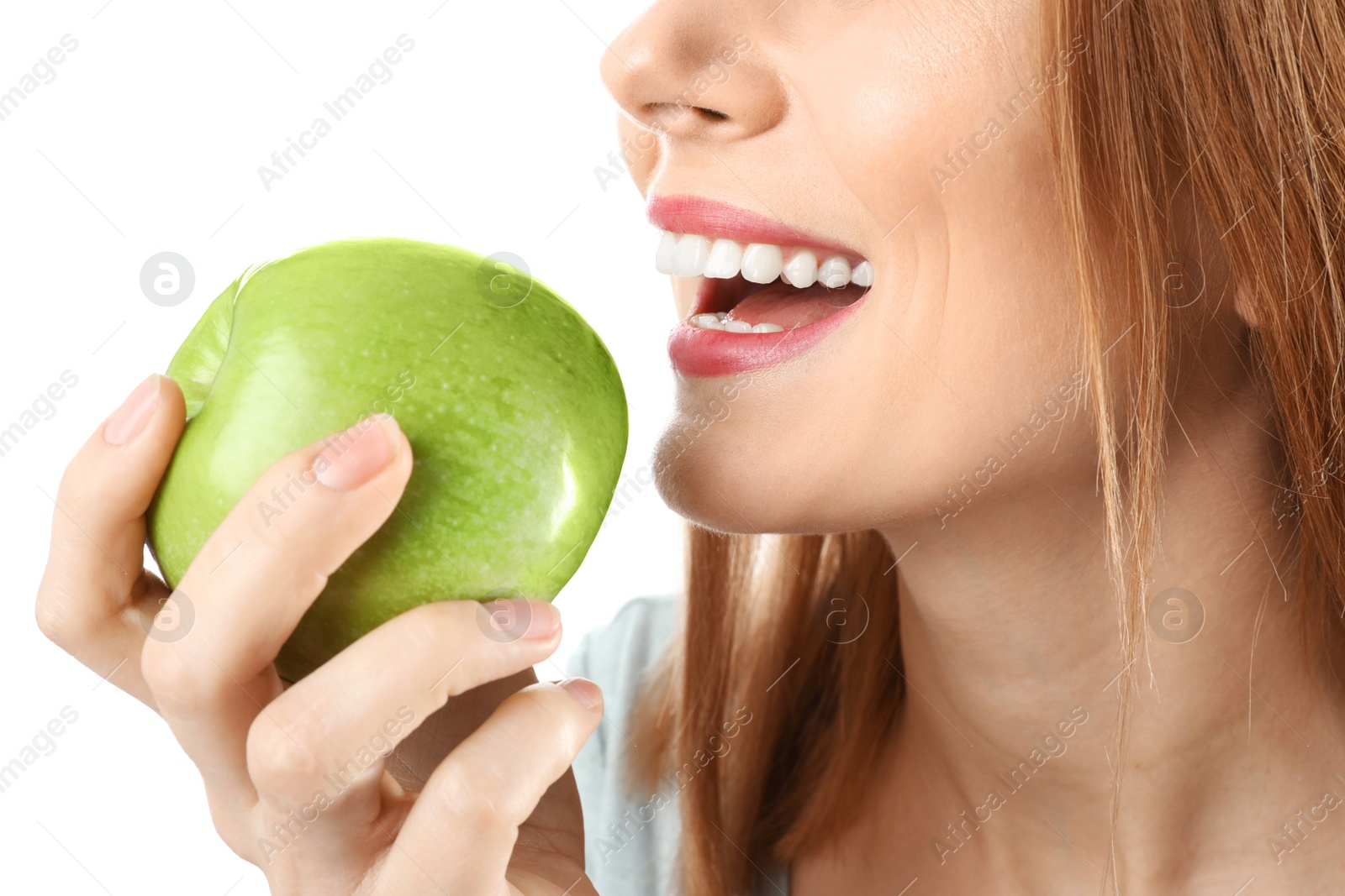 Photo of Smiling woman with perfect teeth and green apple on white background, closeup