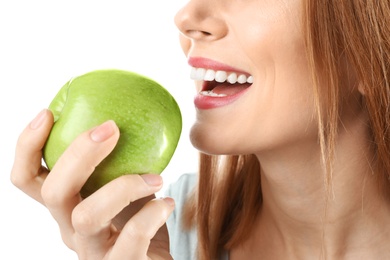Photo of Smiling woman with perfect teeth and green apple on white background, closeup
