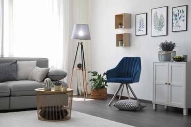 Photo of Elegant living room with comfortable furniture near window. Interior design