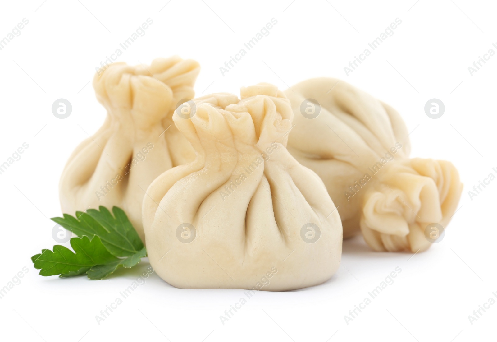 Photo of Boiled dumplings with tasty filling on white background