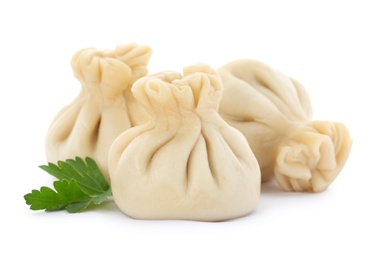 Boiled dumplings with tasty filling on white background