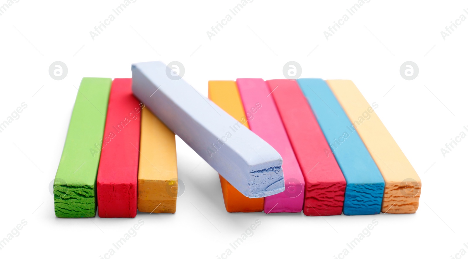 Photo of Colorful pastels on white background. Drawing materials