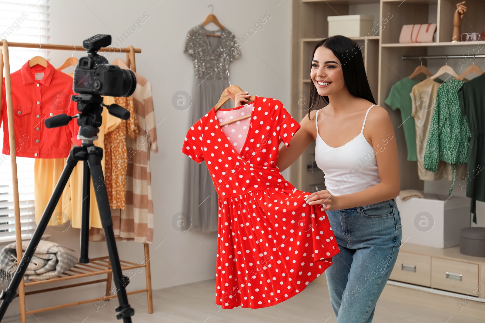 Photo of Fashion blogger recording new video in room