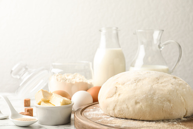 Photo of Fresh dough for pastries on white marble table