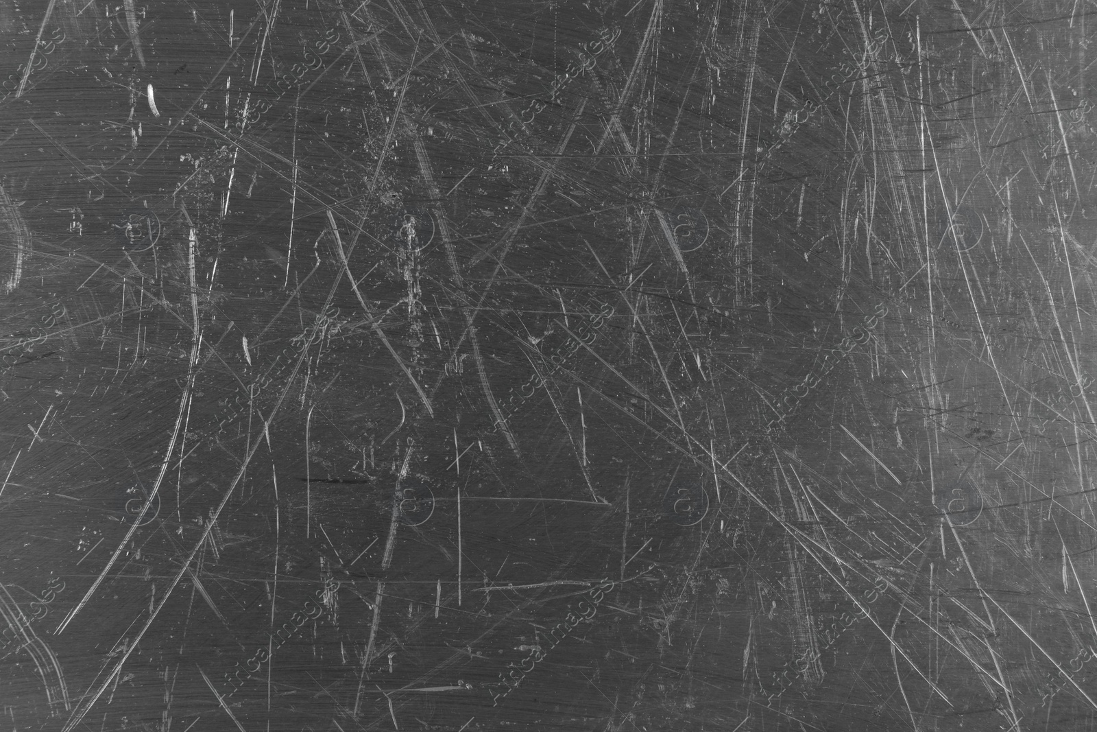 Photo of Texture of scratched metallic surface as background, closeup