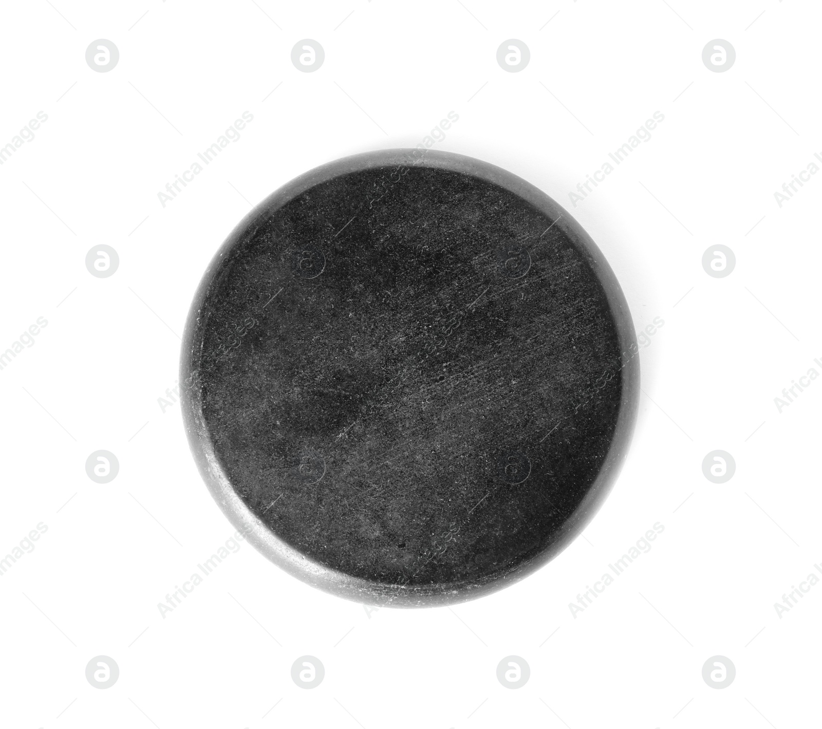 Photo of Black spa stone on white background, top view