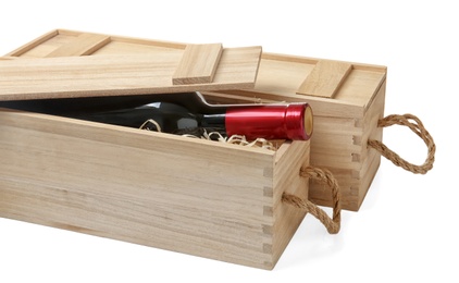 Photo of Wooden crates with expensive wine isolated on white
