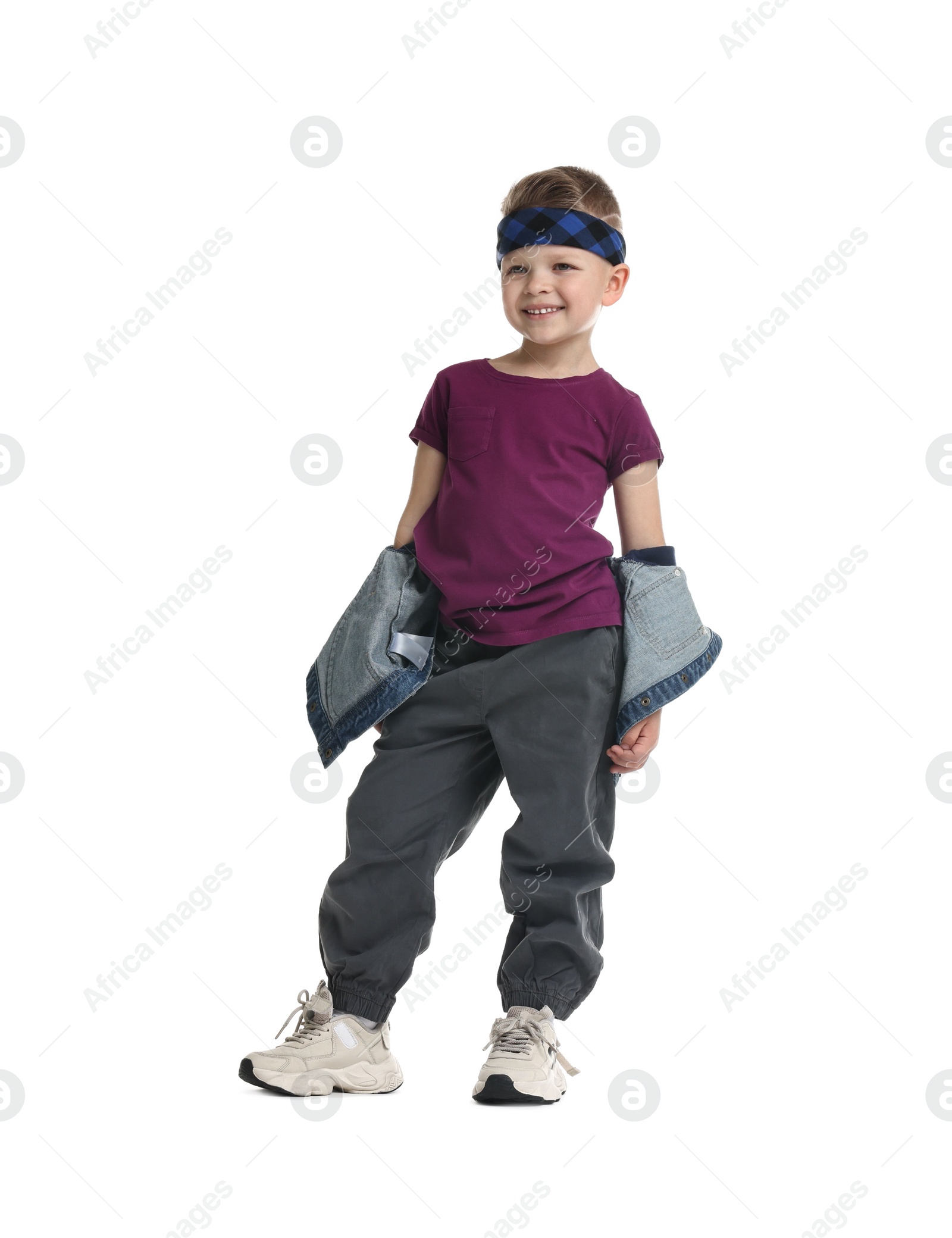 Photo of Happy little boy dancing on white background