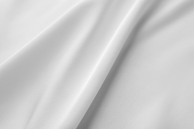 Photo of Texture of white silk ripple fabric as background, top view