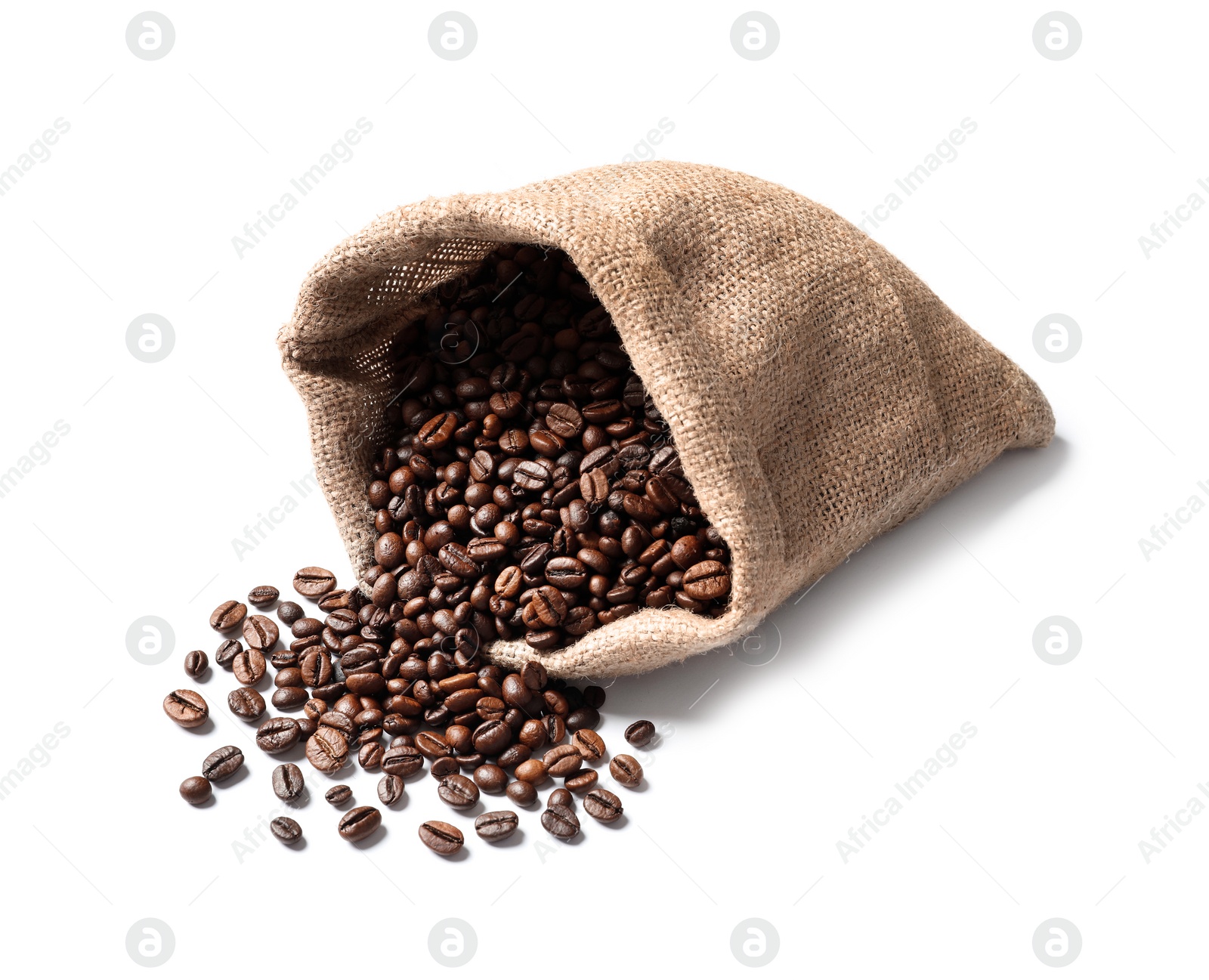 Photo of Overturned bag with roasted coffee beans on white background