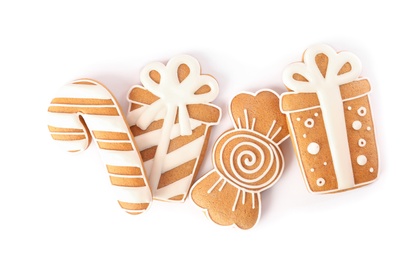 Different delicious Christmas cookies on white background, top view