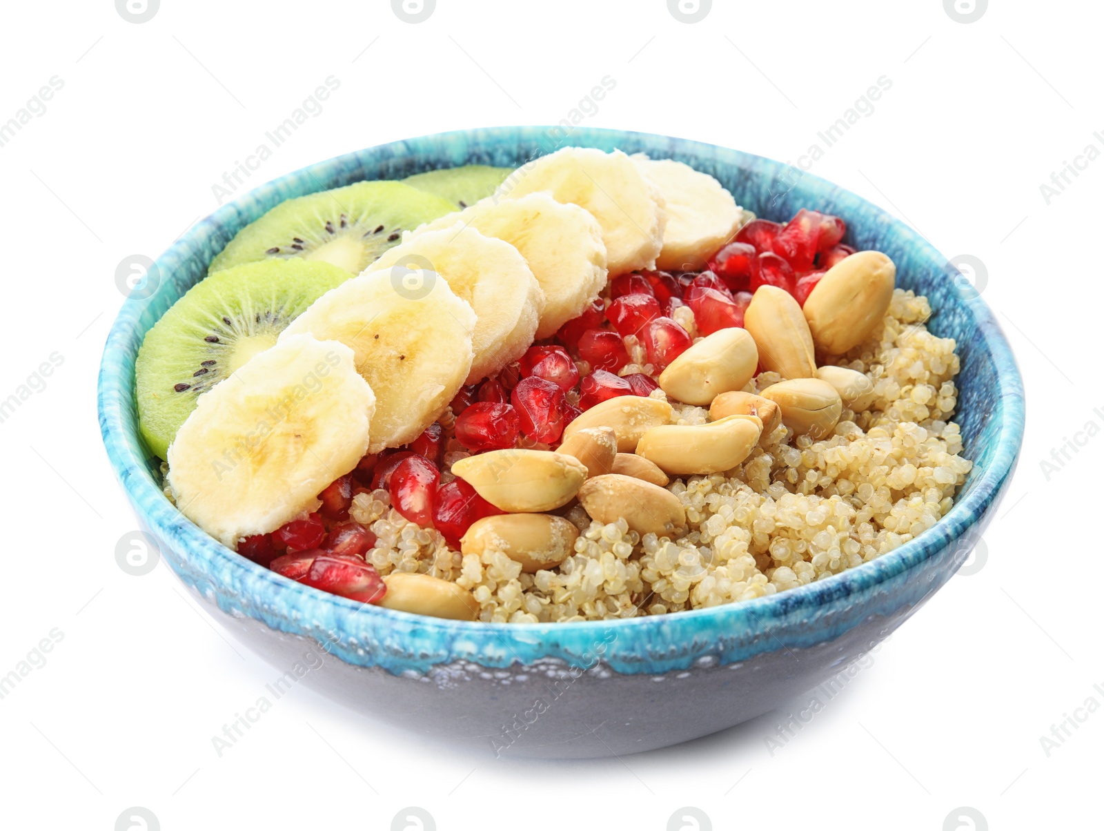 Photo of Bowl of quinoa porridge with peanuts, kiwi, banana and pomegranate seeds on white background