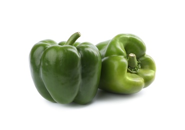 Photo of Fresh ripe green bell peppers isolated on white