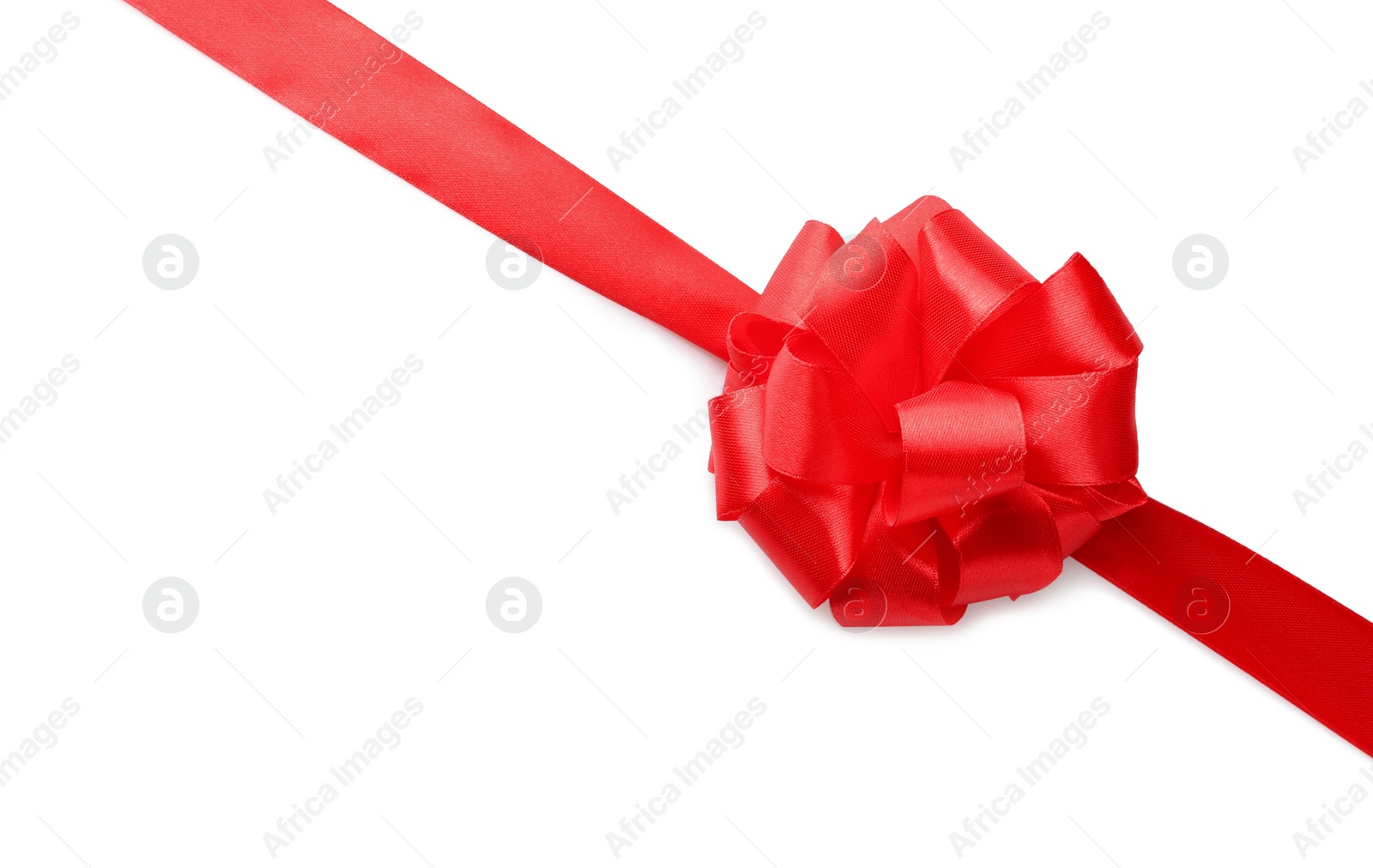 Photo of Red bow and ribbon on white background, top view