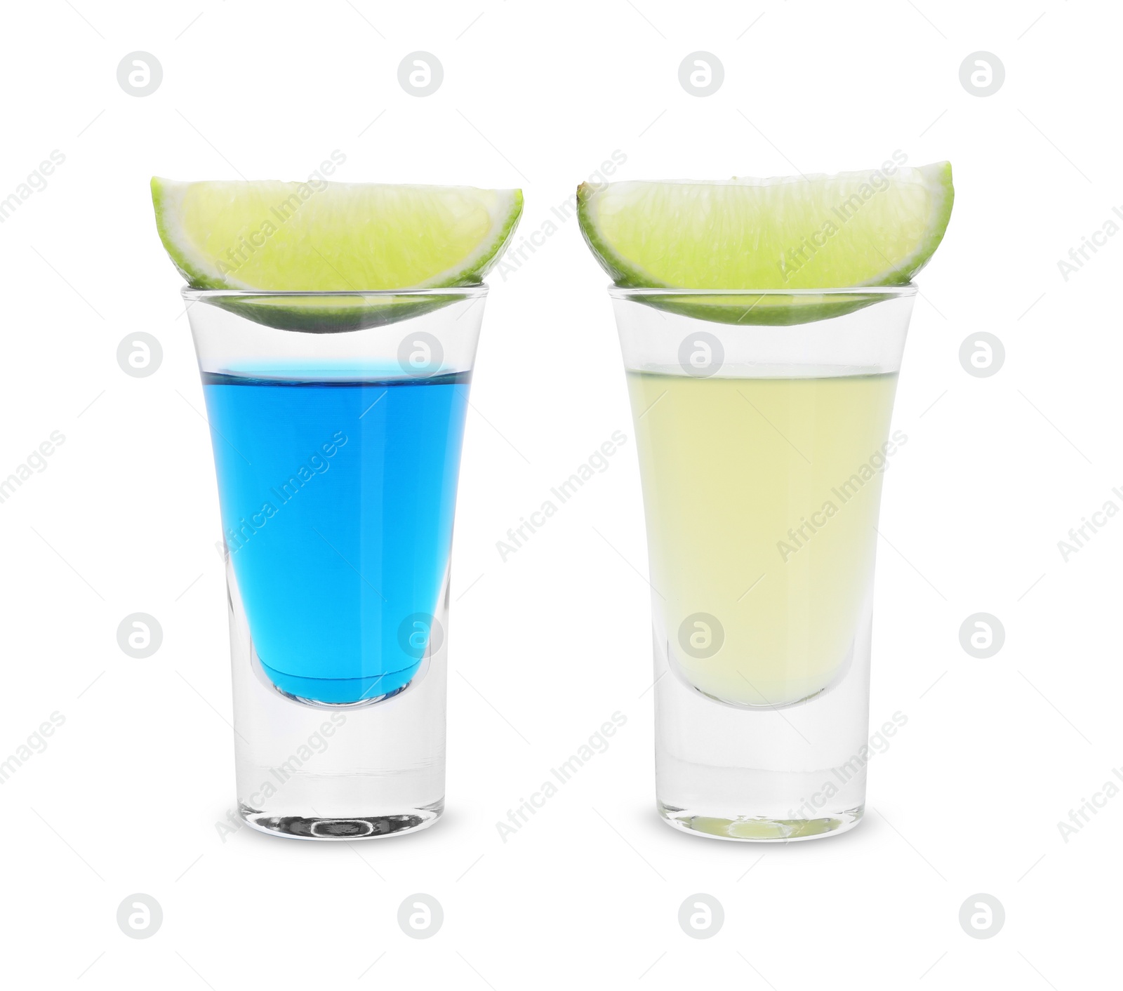 Photo of Different shooters in shot glasses and lime wedges isolated on white. Alcohol drink