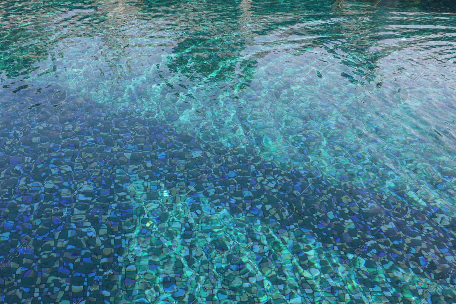 Photo of Clear rippled water in swimming pool outdoors