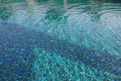 Clear rippled water in swimming pool outdoors