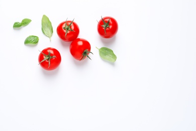 Photo of Composition with ripe cherry tomatoes and basil leaves on white background, top view