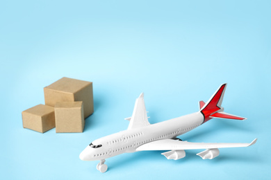 Photo of Toy plane on blue  background. Logistics and wholesale concept