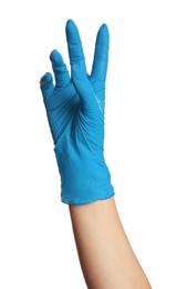 Photo of Woman in blue latex gloves holding something on white background, closeup of hand