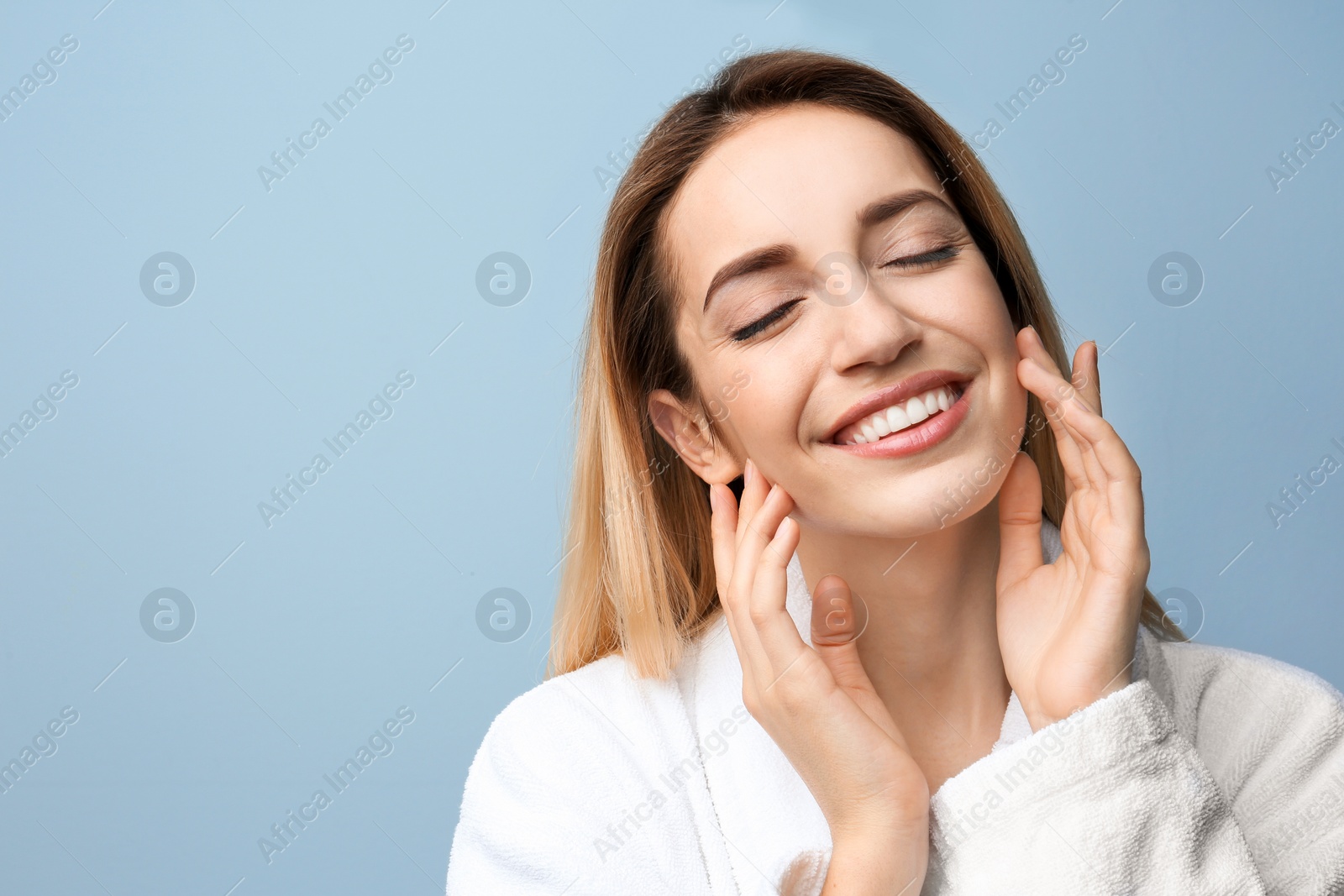 Photo of Beautiful young woman with silky skin on grey background