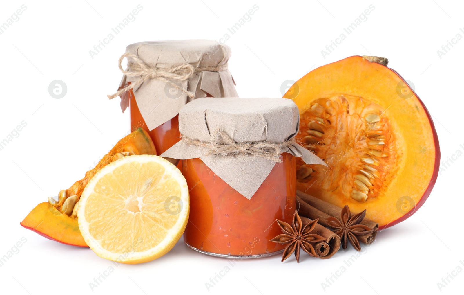 Photo of Jars of pumpkin jam and ingredients on white background