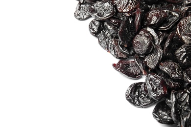 Photo of Many tasty prunes on white background, top view with space for text. Dried fruit as healthy snack