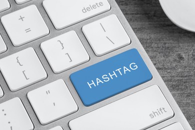Blue button with word HASHTAG on computer keyboard, closeup