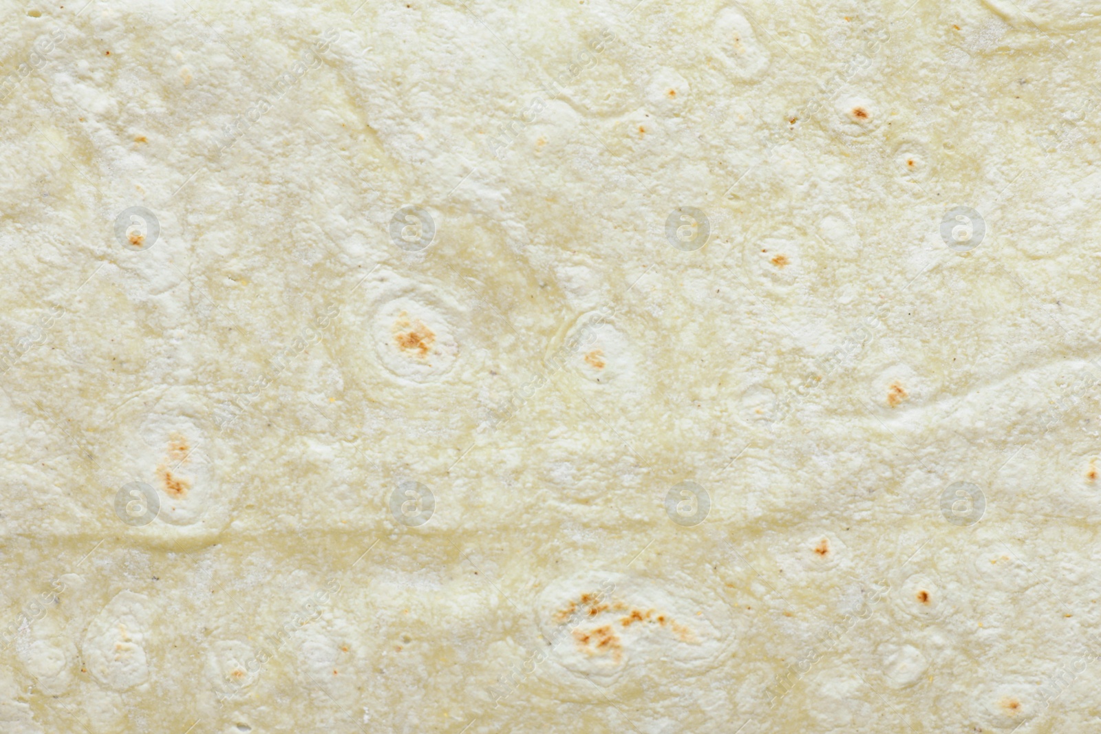 Photo of Texture of green thin Armenian lavash as background, top view