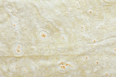 Photo of Texture of green thin Armenian lavash as background, top view