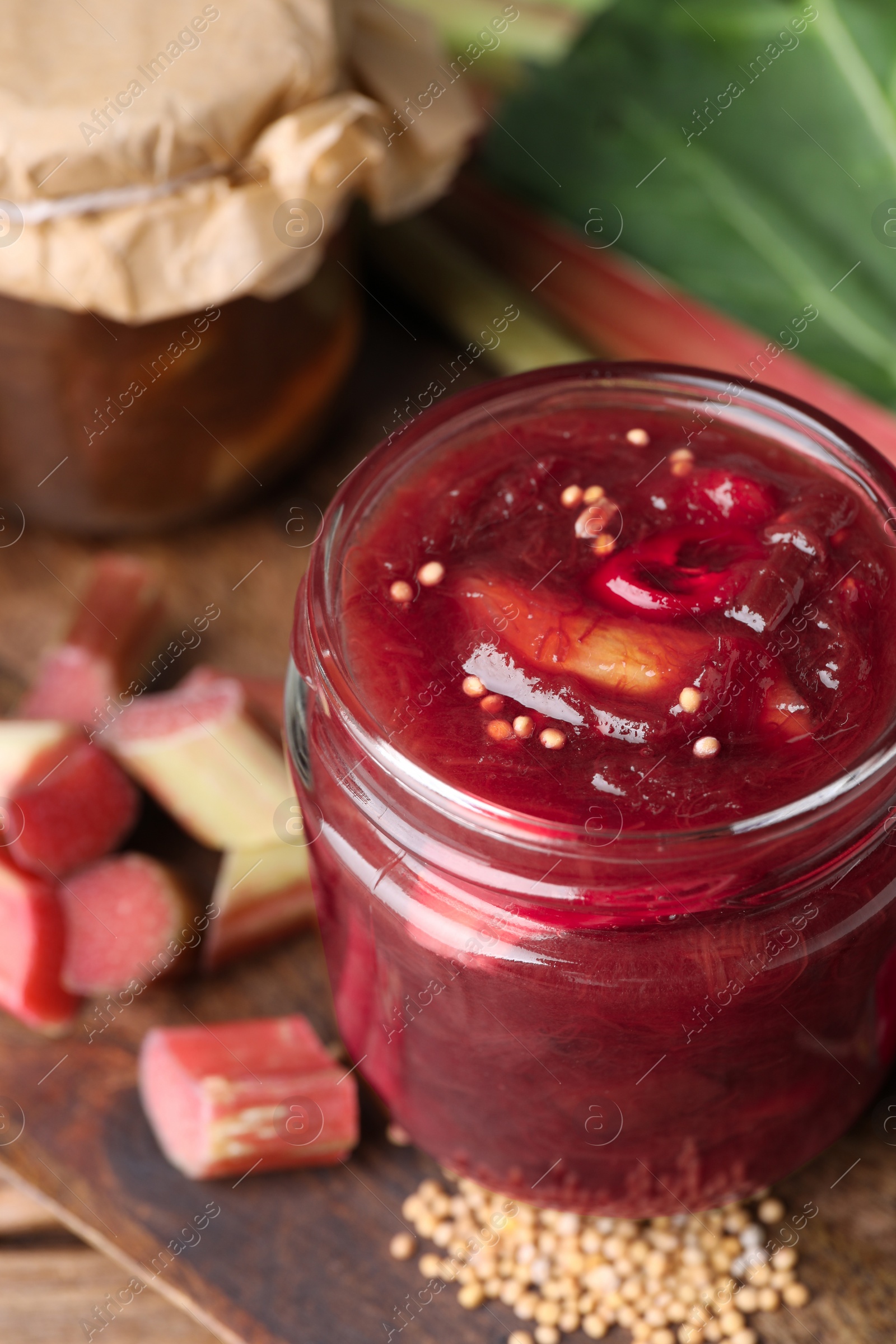 Photo of Tasty rhubarb sauce and ingredients on wooden board