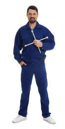 Full length portrait of professional auto mechanic with lug wrench on white background