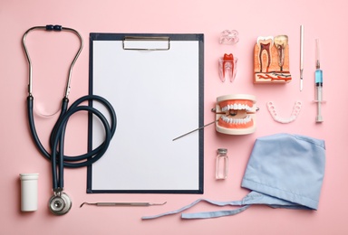 Flat lay composition with medical objects on color background. Space for text