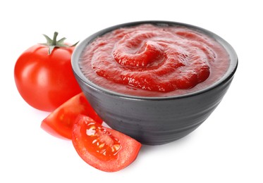 Tasty ketchup in bowl and fresh tomatoes isolated on white, closeup