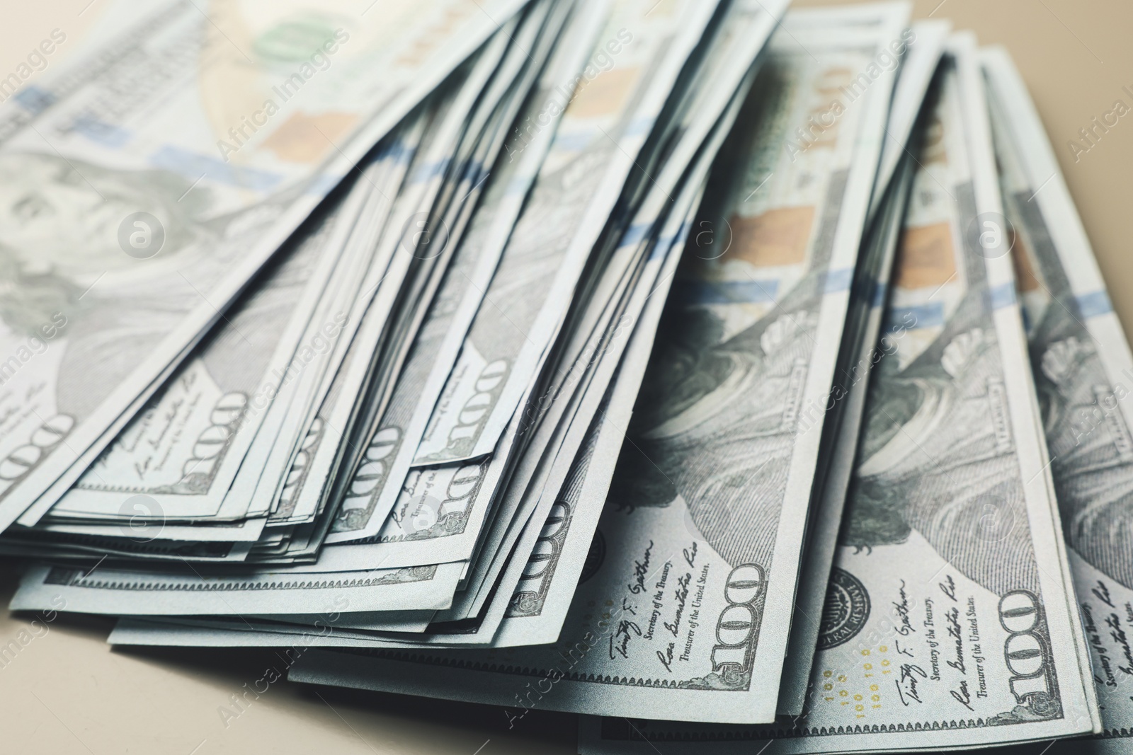 Photo of Dollar banknotes on table, closeup. Money exchange