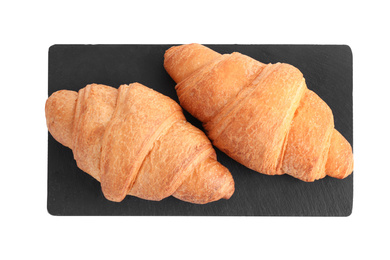 Photo of Tasty fresh crispy croissants isolated on white, top view